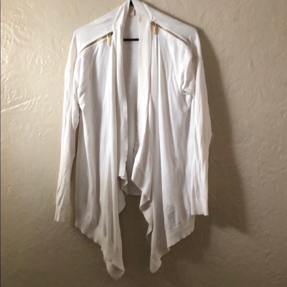White sweater with gold embellishments